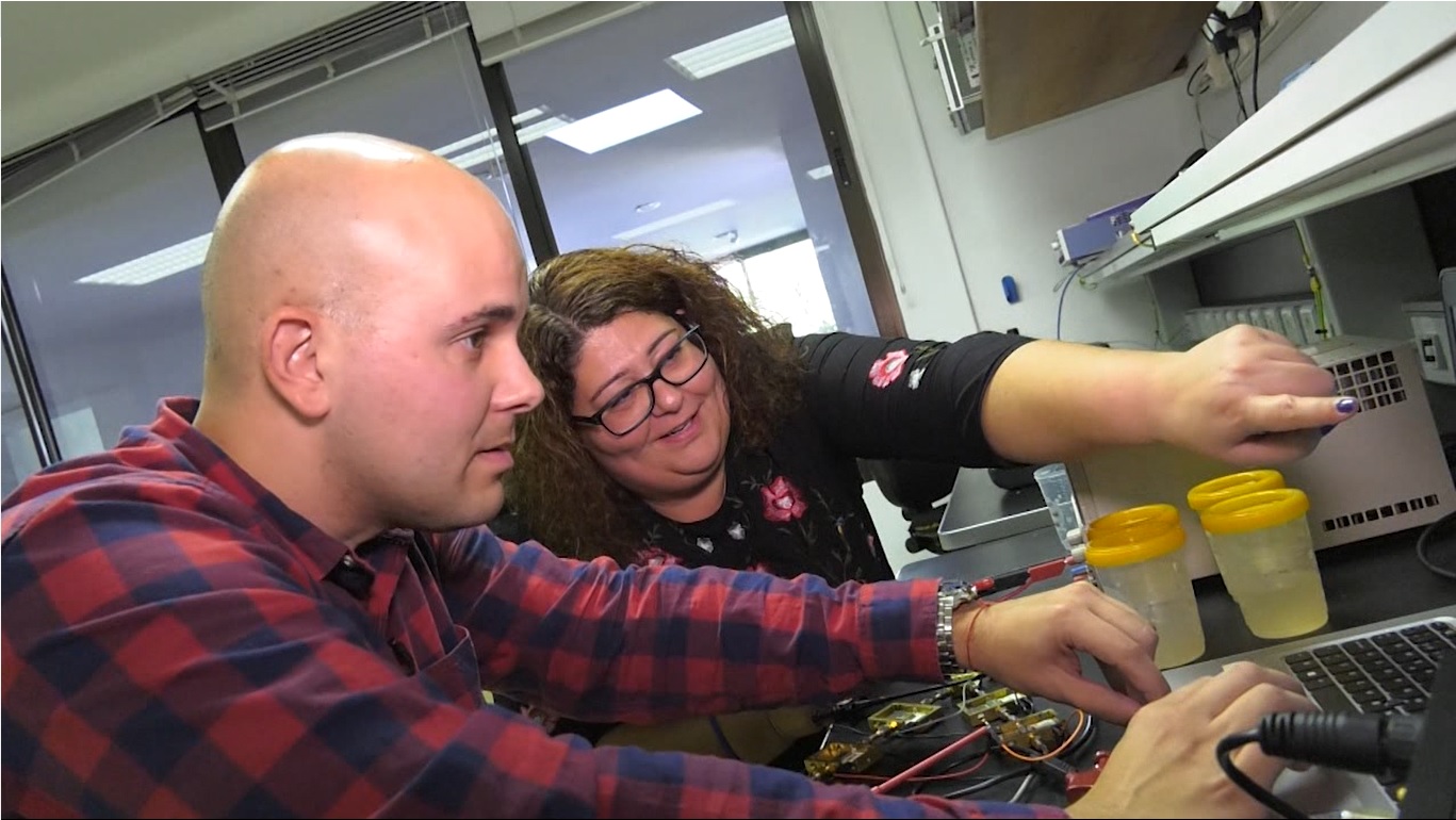 Image of Natalia Arteaga and Enrique Villa, IACTEC engineers, during the preliminary characterization of the system in the Electronics Laboratory of the IAC last November 2019. Credit: Enrique Villa.