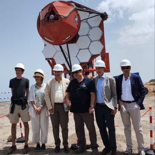 INAF and IAC representatives next to the first telescope of the ASTRI network