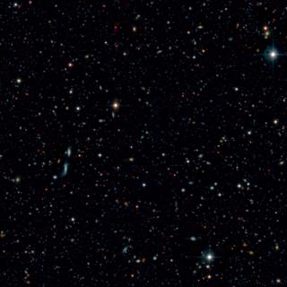 Composite image of the OTELO field. The red color corresponds to the integrated data from the tunable filter of OSIRIS instrument at the GTC, while the blue and green colors correspond to publicly available data from the CFHT Legacy Survey. The field is located in the well-known Groth Extended Strip, with an angular extension of about 55 sq.-arcminutes Project Image